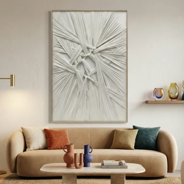 Textured abstract hand-painted canvas with layered white brushstrokes and dimensional relief detail in monochrome, contemporary living space