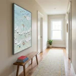 Gestural abstract painting depicting aerial swimmers in turquoise and white impasto brushstrokes, modern hallway