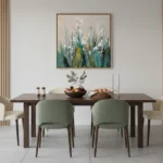 Layered impressionist hand-painted canvas depicting wildflowers and grasses in soft greens, creams, and pale yellows, contemporary dining space