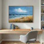 Impressionist coastal landscape hand-painted canvas with windswept golden dunes, turquoise ocean waves, and dramatic cloudy sky, contemporary workspace