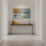Impressionist landscape hand-painted canvas depicting golden tree and snowy riverbank in cool blue tones, contemporary entryway