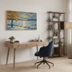 Impressionist landscape hand-painted canvas depicting golden autumn tree by snowy lakeside in cool blue and warm ochre tones, contemporary workspace