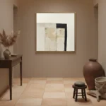 Minimalist abstract hand-painted canvas in cream, black, and taupe geometric forms, styled in contemporary interior
