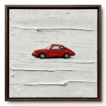Painting of a small red vintage sports car on a thick raw white textured ground, walnut frame