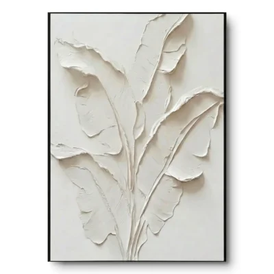 All-white plaster relief of banana leaf fronds, black thin frame