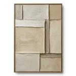 Layered cream and sand textured fabric blocks with raw deckled edges in an asymmetric grid, oak frame