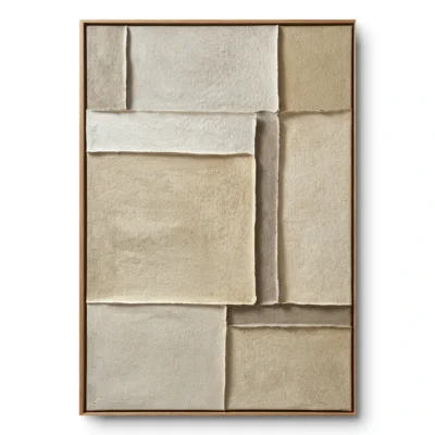 Layered cream and sand textured fabric blocks with raw deckled edges in an asymmetric grid, oak frame