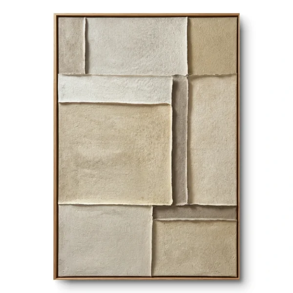 Layered cream and sand textured fabric blocks with raw deckled edges in an asymmetric grid, oak frame