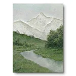 Textured painting of white relief mountains above a green valley with a winding stream and pine trees, light wood frame