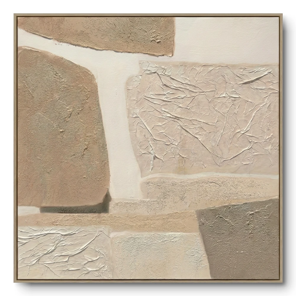 Abstract textured collage of beige, tan and cream blocks with crumpled paper-like sections, natural wood frame