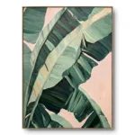 Close-up painting of green banana leaf fronds with a pale pink background showing through the gaps, natural wood frame