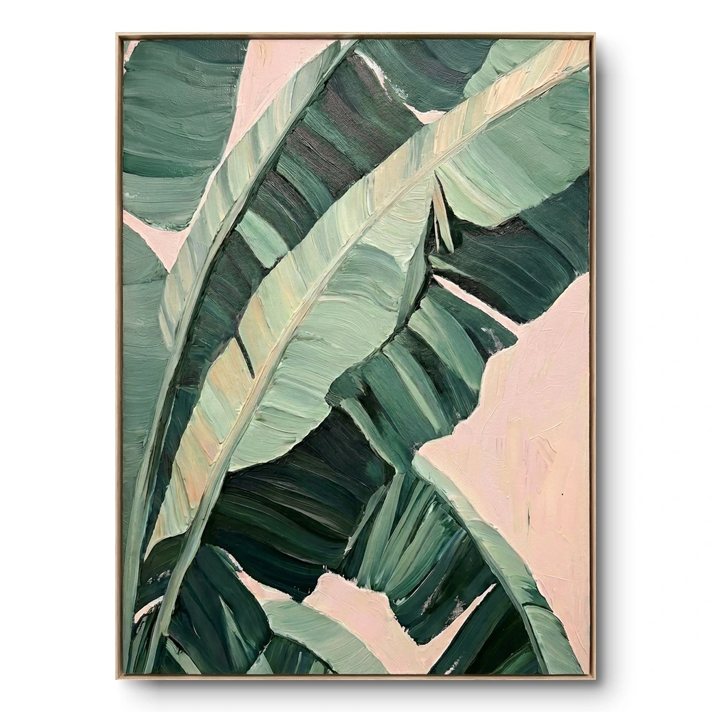 Close-up painting of green banana leaf fronds with a pale pink background showing through the gaps, natural wood frame