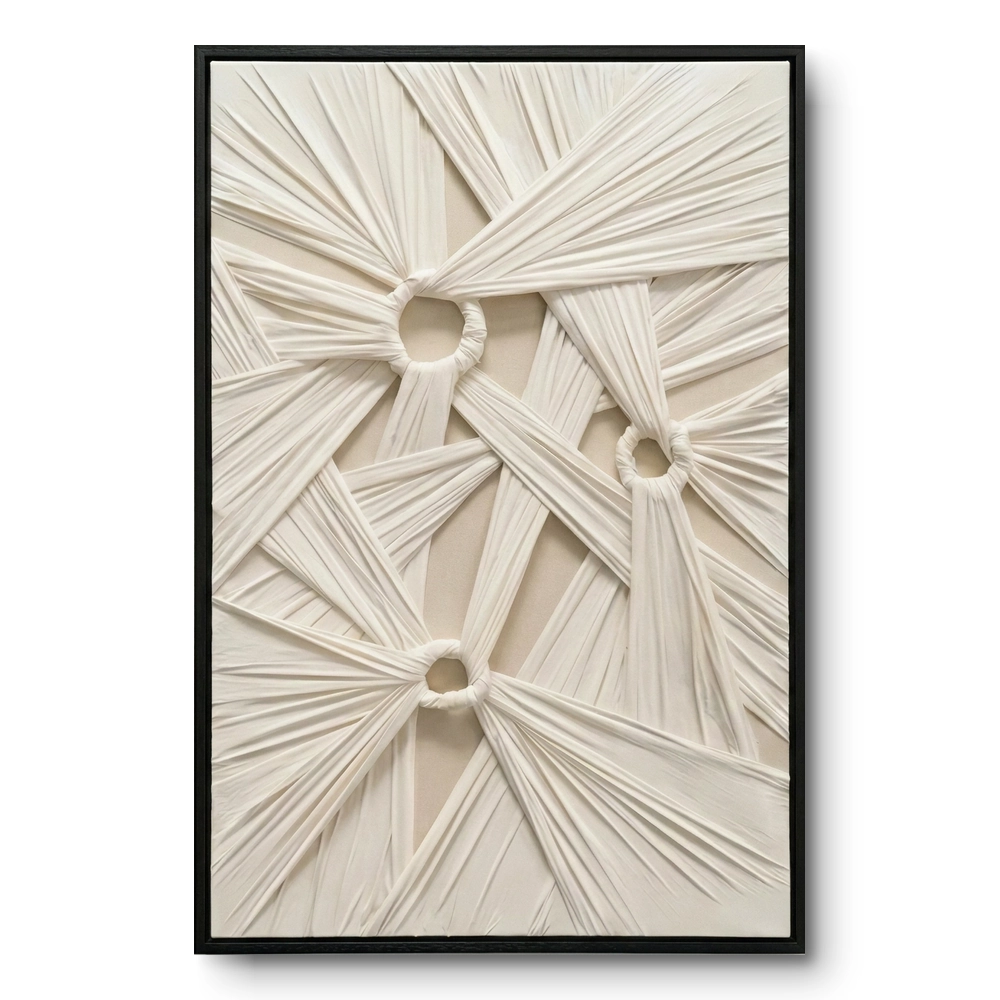 White Knot Sculpture Textured minimalist ribbon web fabric wall art Three cinched ivory fabric knots anchoring a web of pleated diagonal folds in raised relief, framed in a slim black frame.