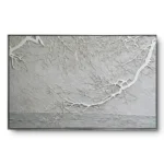 Textured relief painting of raised white frosted branches against a grey wall and water horizon, black thin frame