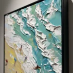 Turquoise Shore textured wall art shown framed on the wall in a styled interior
