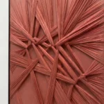 Woven Ember textured wall art shown framed on the wall in a styled interior