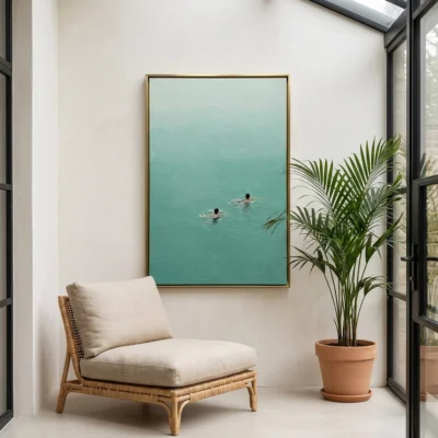 Two Swimmers textured wall art shown framed on the wall in a styled interior