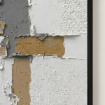Concrete Seam textured wall art shown framed on the wall in a styled interior