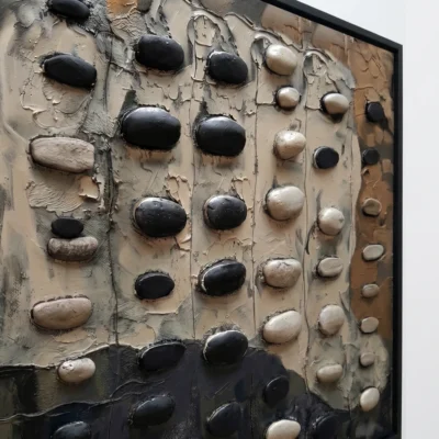 Pebble Field textured wall art shown framed on the wall in a styled interior