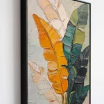 Ochre and Emerald textured wall art shown framed on the wall in a styled interior