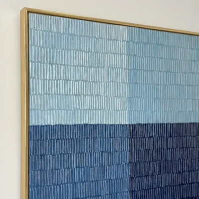 Indigo Quadrant textured wall art shown framed on the wall in a styled interior