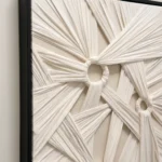 Threefold Knot textured wall art shown framed on the wall in a styled interior
