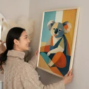 Contemporary figurative hand-painted canvas depicting a stylized koala in geometric color blocking with teal, mustard, and navy tones, modern living space