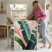 Gestural abstract hand-painted canvas in layered pink, teal, and forest green brushstrokes, contemporary studio setting