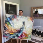 Gestural abstract expressionist hand-painted canvas in vibrant multicolored brushstrokes with dynamic swirling forms, contemporary living space