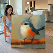 Painterly contemporary wall art depicting a blue-crested robin with vibrant orange breast on warm ochre branch, muted sage and terracotta palette, modern kitchen setting